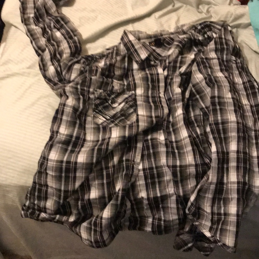 grey, black, and white plaid shirt fits larges.